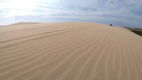 Strong wind in the desert, white sand dunes in Mui Ne, Vietnam. Stock Footage 103837365