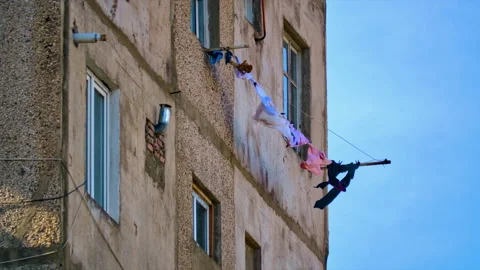 A strong wind develops drying clothes hanging on clotheslines outside the window Stock Footage 234206116