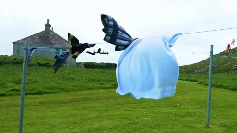 Strong Wind Dries the Clothes on the Line, Sunny Day, Slow Motion, LOOP Stock Footage 156303391