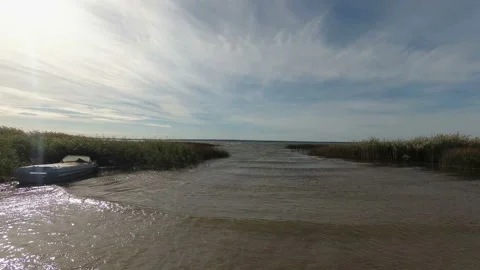 Strong wind on the lake. Time lapse. The camcorder rotates smoothly from left to Stock Footage 97105423