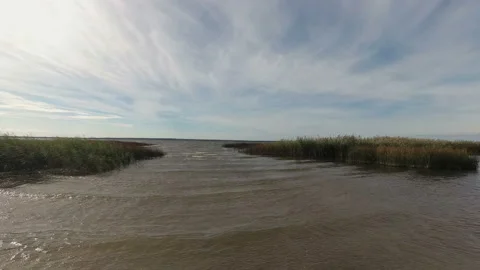Strong wind on the lake. Time lapse. The camcorder rotates smoothly from left to Stock Footage 97105430
