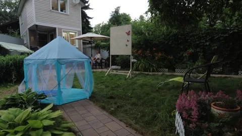 Strong wind moves and blows the toy tent across the site Stock Footage 304748046