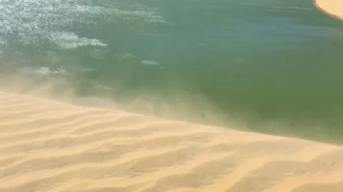 Strong wind moving sand grain at the top of a dune Stock Footage 176226023