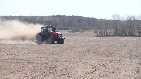 A strong wind raises dust on the field Stock Footage 130047571