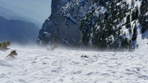Strong wind ripping off snow from the top Stock Footage 87806684