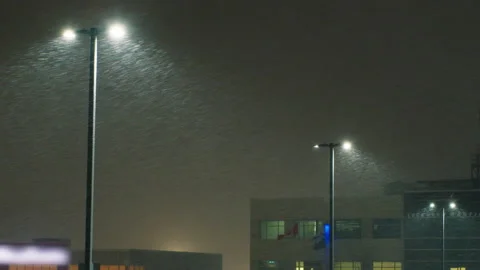 Strong wind with sleet against the background of glowing lanterns. Stock Footage 234902918