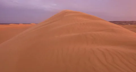 Strong wind at sunset over the sand dunes in the desert. Sandstorm in the Desert Stock Footage 168174307