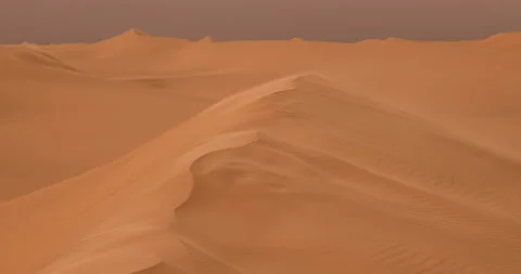 Strong wind at sunset over the sand dunes in the desert. Sandstorm in the Desert Stock Footage 168181639