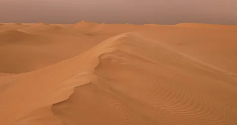 Strong wind at sunset over the sand dunes in the desert. Sandstorm in the Desert Stock Footage 205841011
