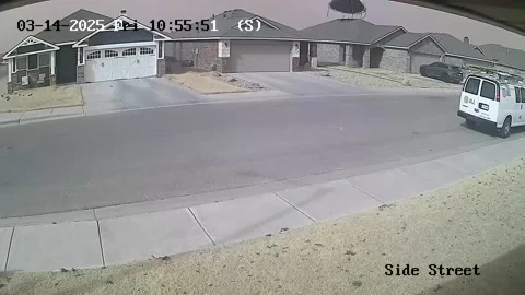 Strong Winds Send Trampoline Flying Over House, Lubbock, Texas, USA - 14 Mar 202 Stock Footage 304442956