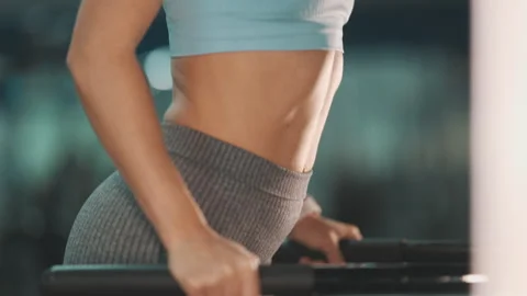 Strong woman performing dips on parallel bars 스톡 동영상 328301665