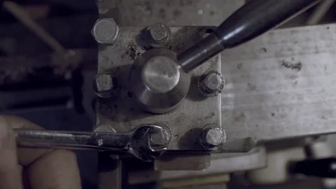 Strong work-worn hands unscrews the with a wrench bolt. Good for you The camera Stock Footage 81696685