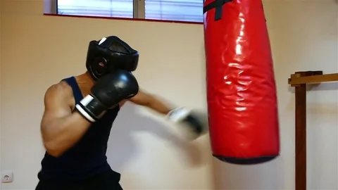 Strong young boxer hitting the boxing bag. Stock Footage 83626855
