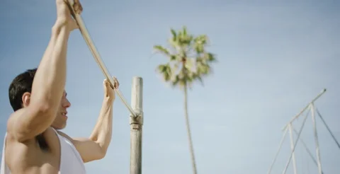 Strong young man performing pull ups on bar Stock Footage 106199731