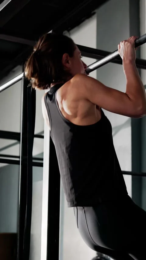 Strong Young Woman Doing Pull Up Workout Stock Footage 287826076