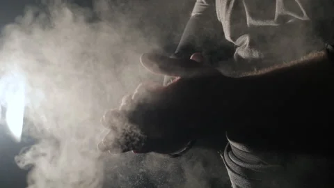 Strongman athlete hands clapping chalk powder sportsman preparing training Stock Footage 150984336