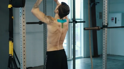 Strongman pulls up on bar in gym Stock Footage 106142542