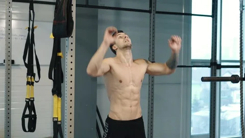 Strongman pulls up on bar in gym Stock Footage 106142772