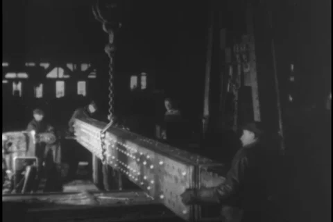 Structural beam being arranged by workers - 1930 Stock Footage 104336425