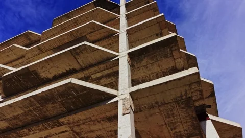 Structural design of concrete building in aerial view under clear sky Stock Footage 325087149