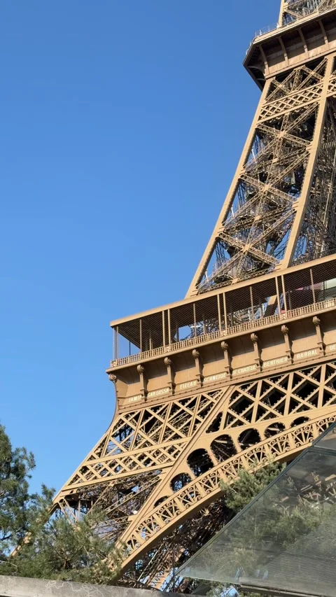 Structural elements of Eiffel tower against bright blue day sky Stock Footage 346671654