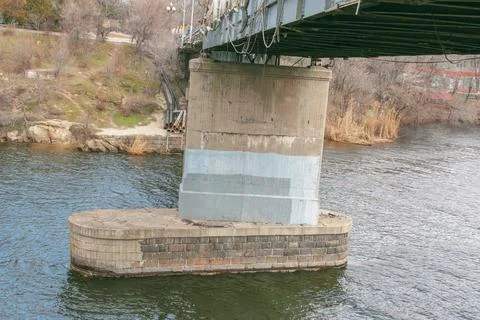 Structural elements of the old pedestrian bridge built in the USSR across t.. Stock Photos