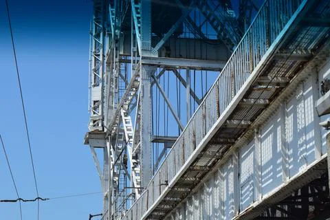Structural elements of an old steel bridge. Arches and farms riveted. Stock Photos