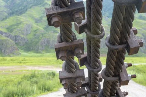 Structural elements of a suspended metal bridge over the Katun River Fotos Stock