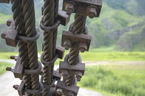 Structural elements of a suspended metal bridge over the Katun River Fotos Stock