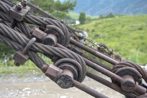 Structural elements of a suspended metal bridge over the Katun River Fotos Stock