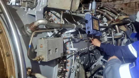 Structural engineer assesses turbine welds and fasteners using ultrasonic Stock Footage 283554775