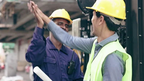 Structural engineers and construction workers are holding blueprints inspecting  Video stock 235887120