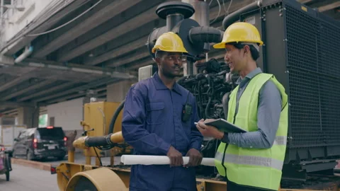 Structural engineers and construction workers are holding blueprints inspecting  Stock Footage 241426521