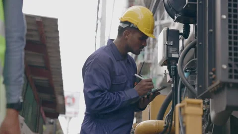 Structural engineers and construction workers are holding blueprints inspecting  Stock Footage 241509779