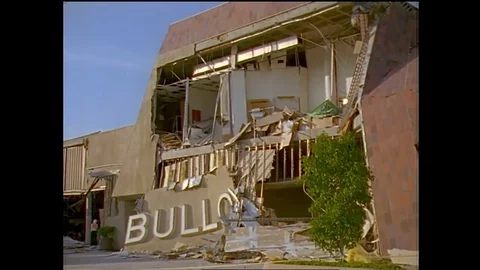 Structural engineers study a collapsed shopping center during the 1994 Stock Footage 74837041