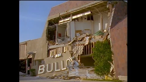 Structural engineers study a collapsed shopping center during the 1994 Stock Footage 123377803