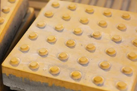 Structural outdoor tile with bulges for visually impaired people. Tile road s Stock Photos