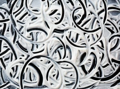 Structural plaster white on a black background. White Cream. paint smear. Stock Photos