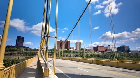 Structural view of yellow color Roberto Clemente Bridge against blue sky in.. Stock Footage 321782032