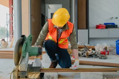 Structural worker dressed in safety gear and hard hat doing construction an.. Stock Photos