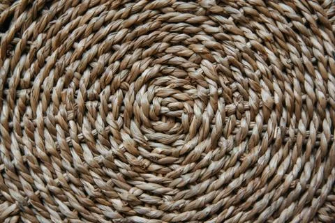 Structure and background of a wicker basket. Pattern of round texture. Close Stock Photos