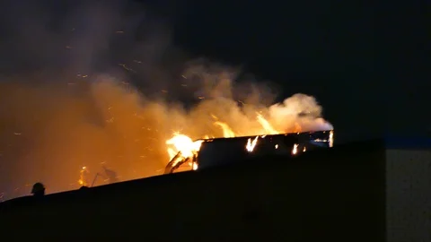 Structure burning with flames and smoke Stock Footage 116081307