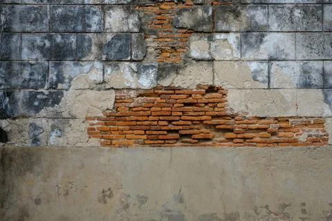 Structure of decaying vintage clay bricks wall and cement, weathered textured Stock Photos