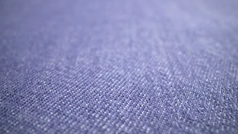 The structure of the fabric. Close-up of blue denim fabric. Dolly shot Видео 244501426