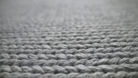 The structure of the fabric. Close-up of knitted cotton fabric. Dolly shot 動画素材 244506809