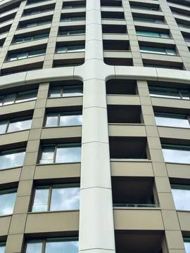 The structure features a unique cross pattern and multiple large windows. It  Stock Photos