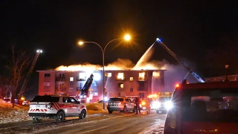 Structure fire becoming inferno Stock Footage 105293996