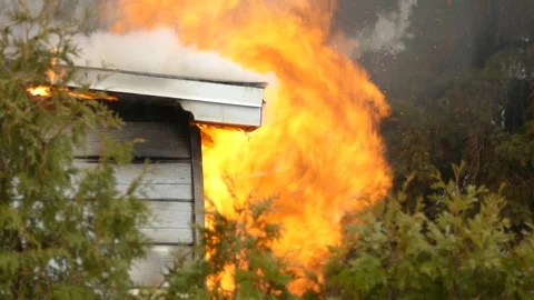 Structure fire burning a house Stock Footage 112022733