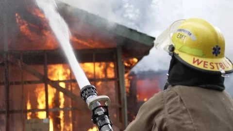 Structure Fire Firefighter Spraying Water Stock Footage 261483720