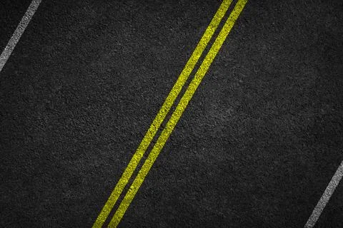 Structure of granular asphalt. Asphalt texture with two yellow line road Stock Photos